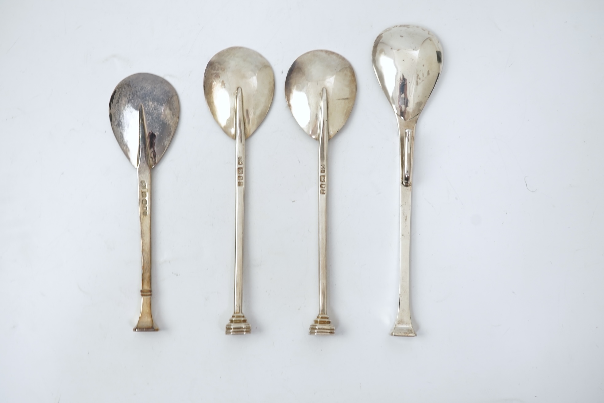 A pair of Elizabeth II silver 'seal top' spoons by The Guild of Handicrafts, London, 1990, 16cm, together with a similar later spoon, London, 2008 and a similar preserve spoon, London, 2003, two with boxes.